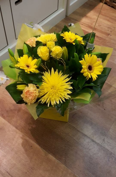 Morning Sun - Bright flowers in colours of orange and yellow presented in an aqua box to include lush greenery.