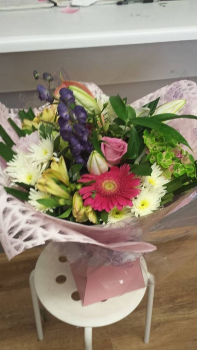 Mixed Hand tied - A aquapacked handtied bouquet presented in a decorative box finished with a ribbon bow.