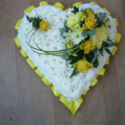 Based heart - A based heart shaped funeral tribute with ribbon edging and rose cluster colours of your own choice,available in small.medium or large