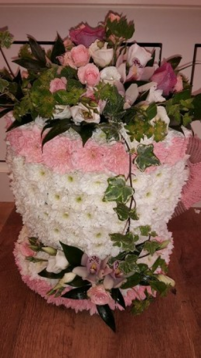 TEA CUP AND SAUCER - A  3D tribute based in white chrysanthemums  with an arrangement on  pink roses,white lisianthus.orchids and mixture of foliage