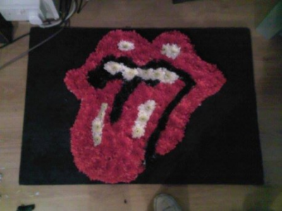 funeral tribute rolling stones - based in white chrysanthemums and sprayed to colours in picture